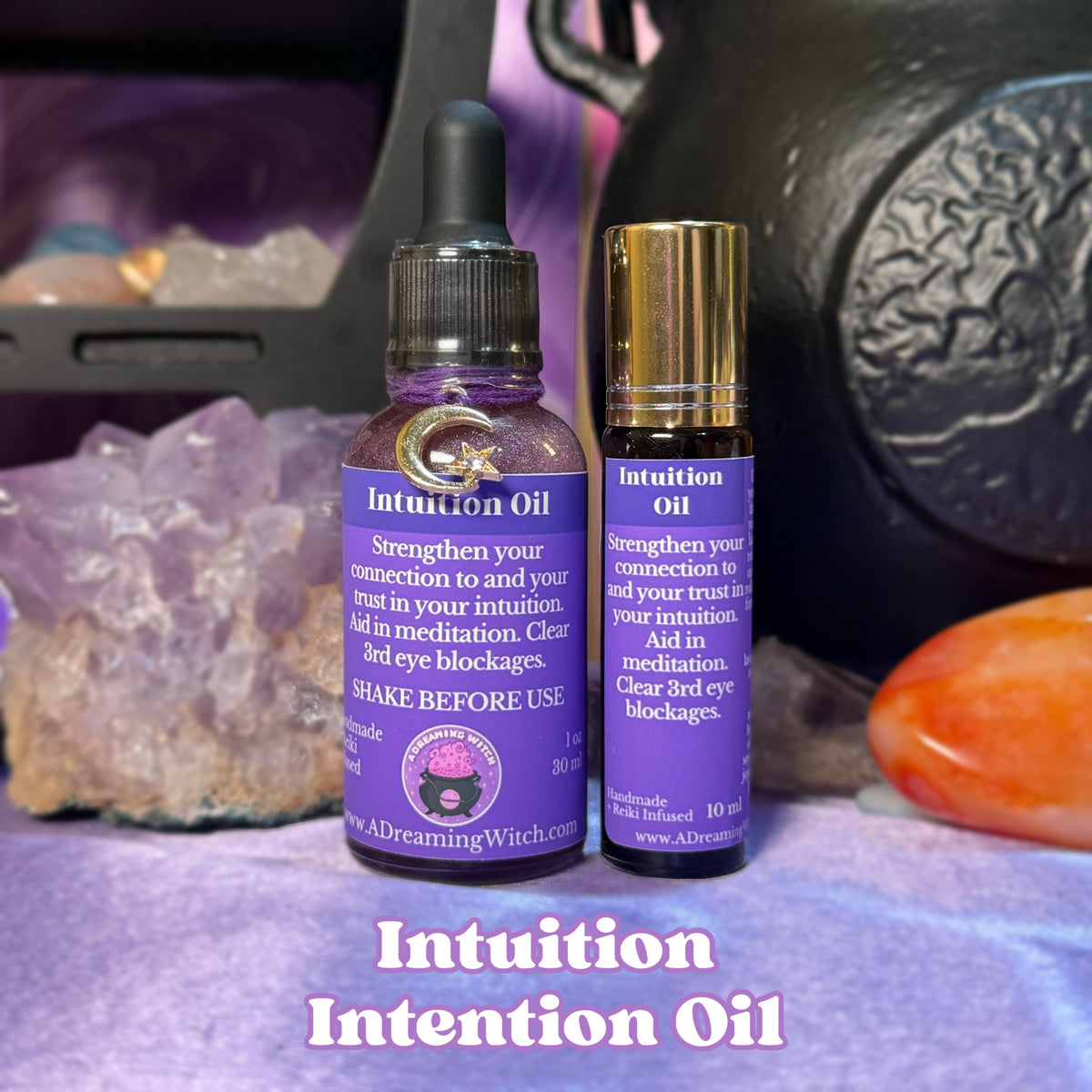 Two bottles of Intuition Oil with purple labels on a mystical background with crystals and cauldron.